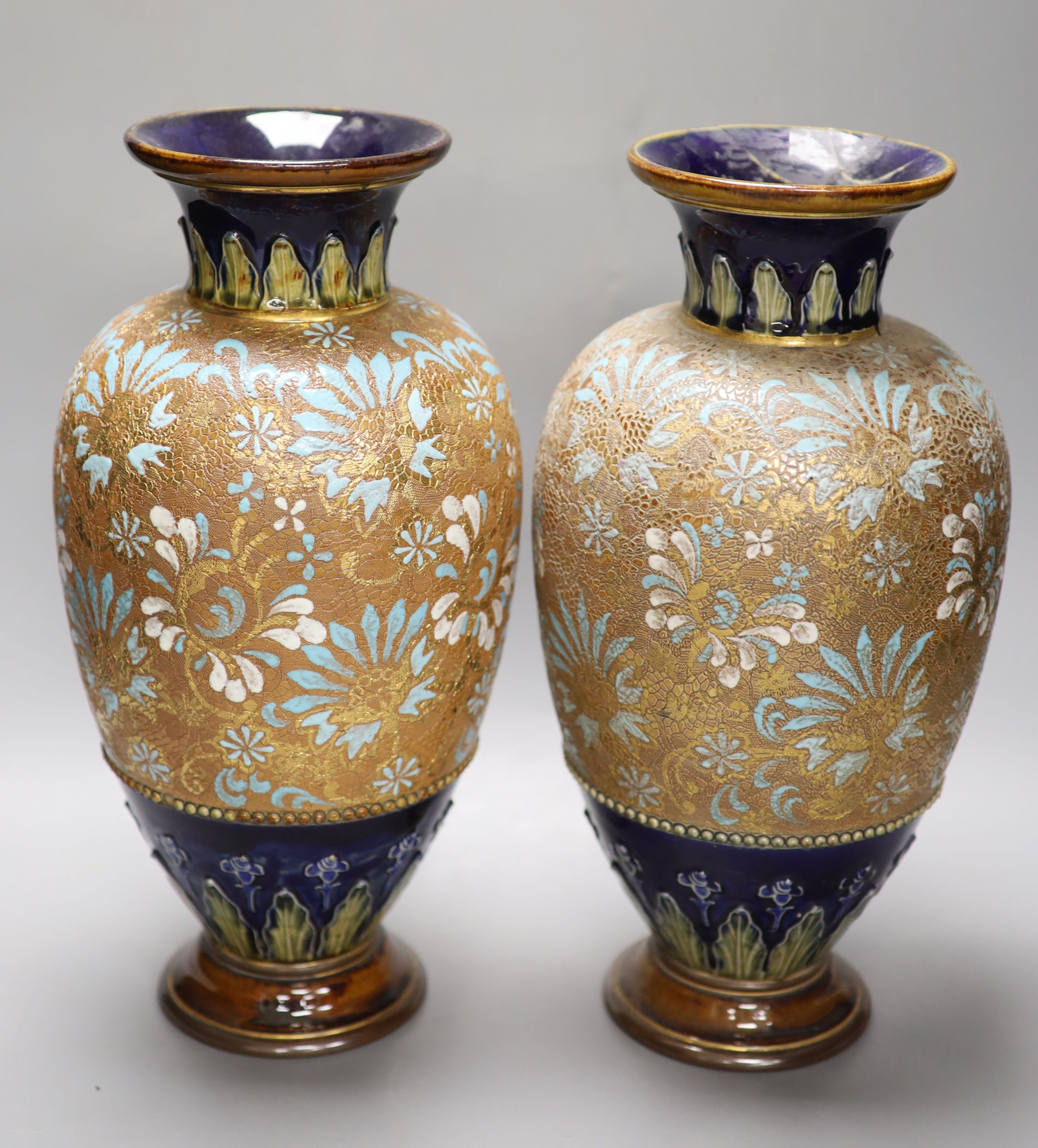 A pair of Royal Doulton Art Nouveau ovoid tubelined vases, impressed number 8079, monogram WB and a pair of Slaters Patent vases, hei